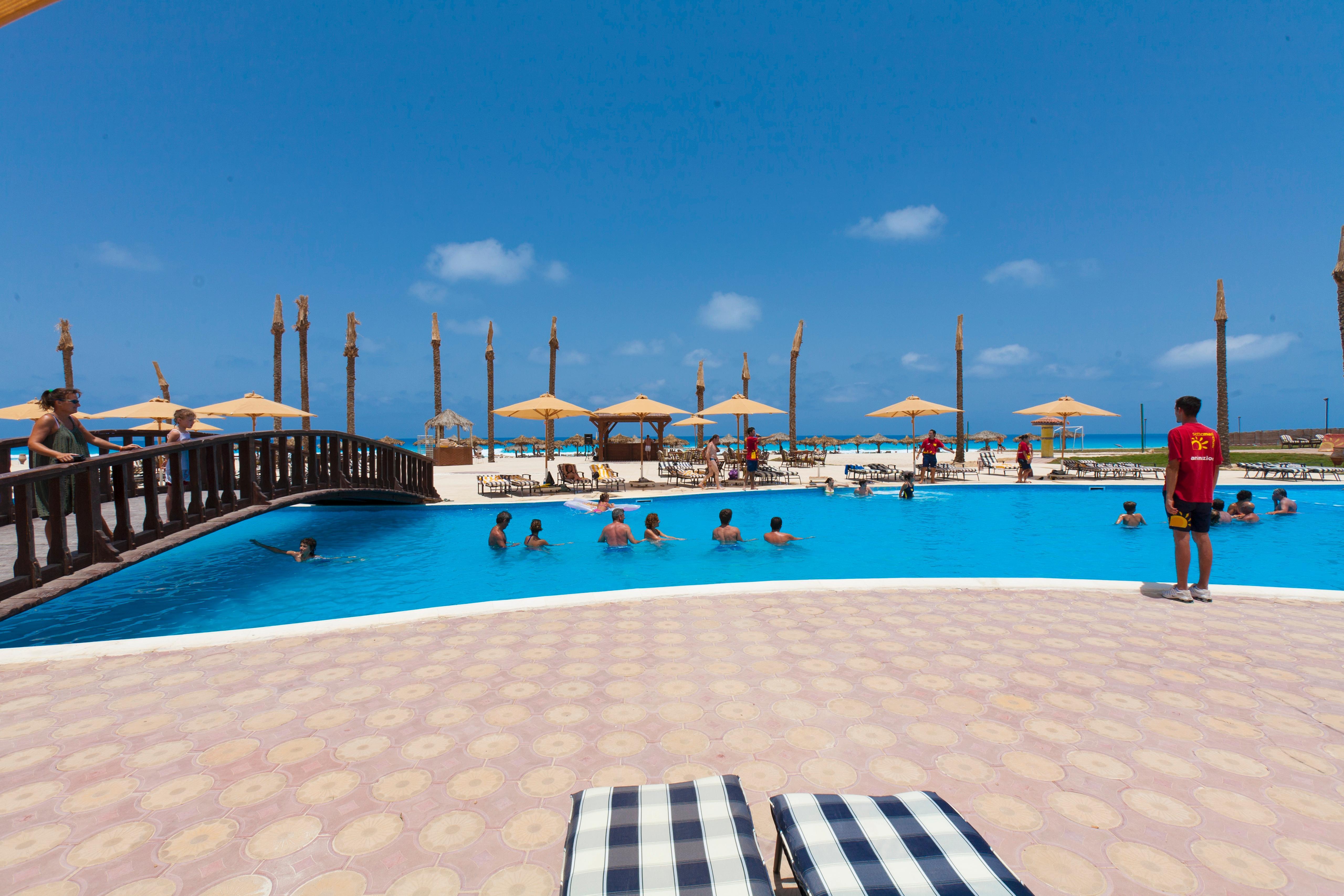 Borg El Arab Beach Resort Kültér fotó The swimming pool at the resort