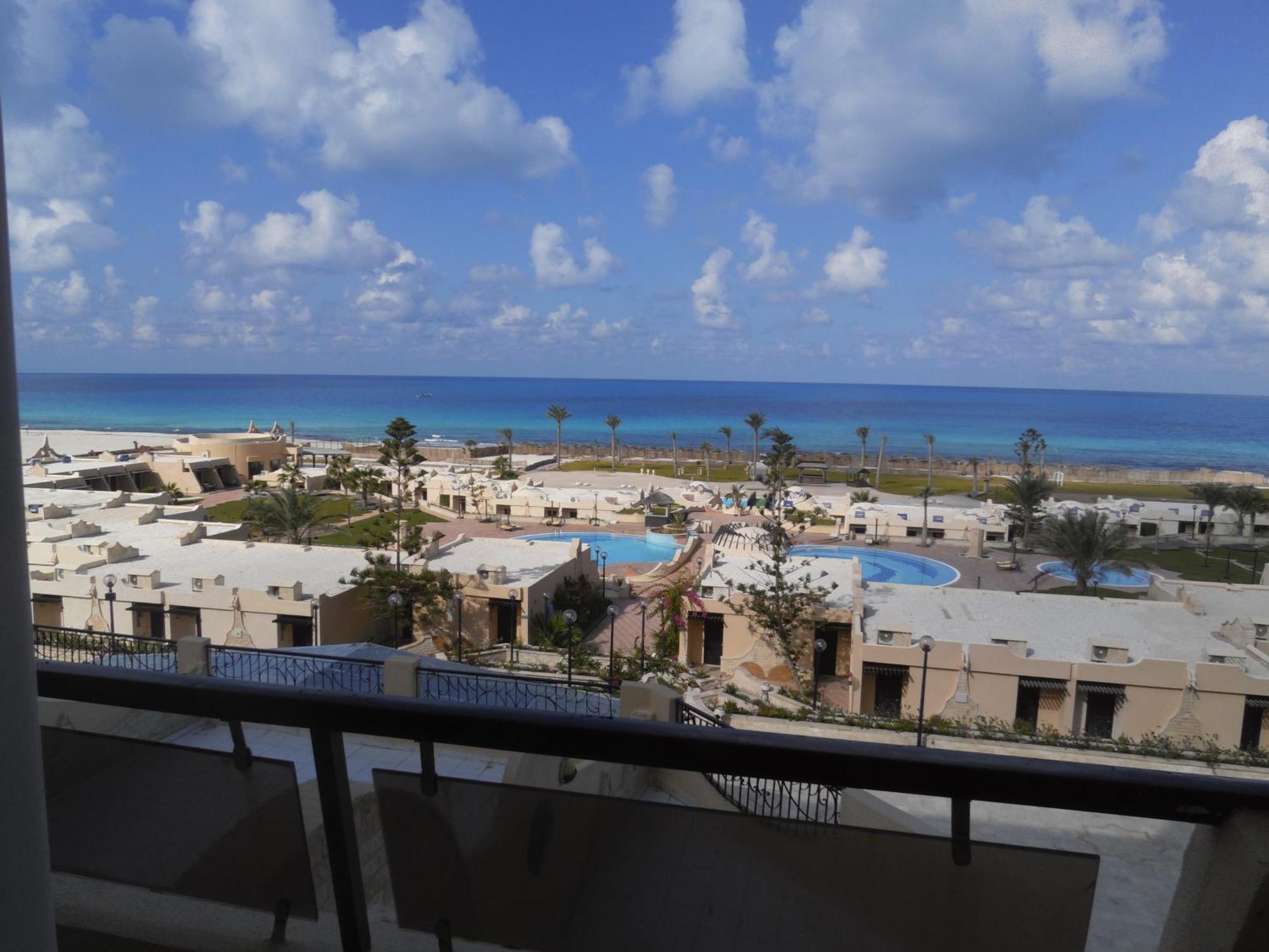 Borg El Arab Beach Resort Kültér fotó View of the beach from the hotel