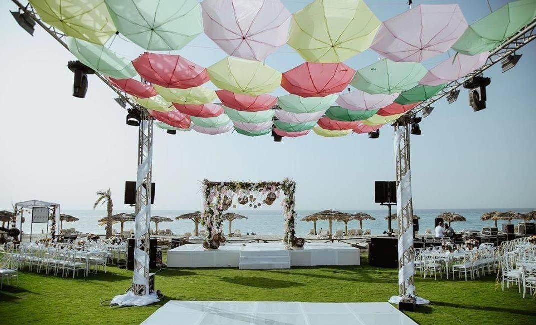 Borg El Arab Beach Resort Kültér fotó A canopy of umbrellas