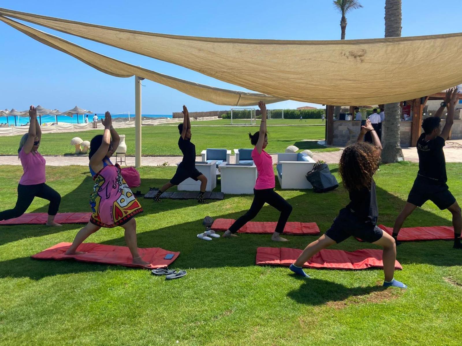 Borg El Arab Beach Resort Kültér fotó A yoga class in Egypt