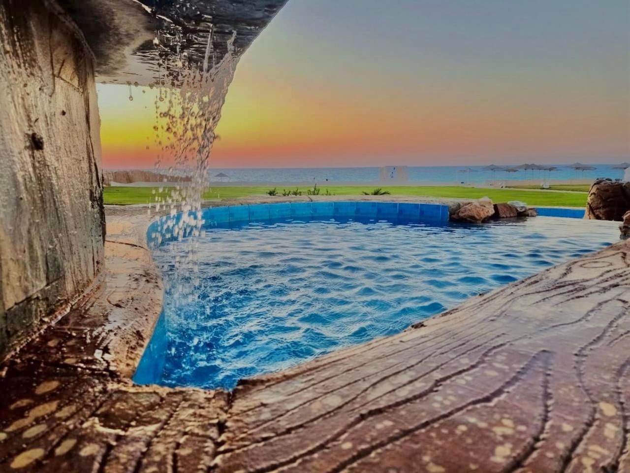 Borg El Arab Beach Resort Kültér fotó Sunset at the beach